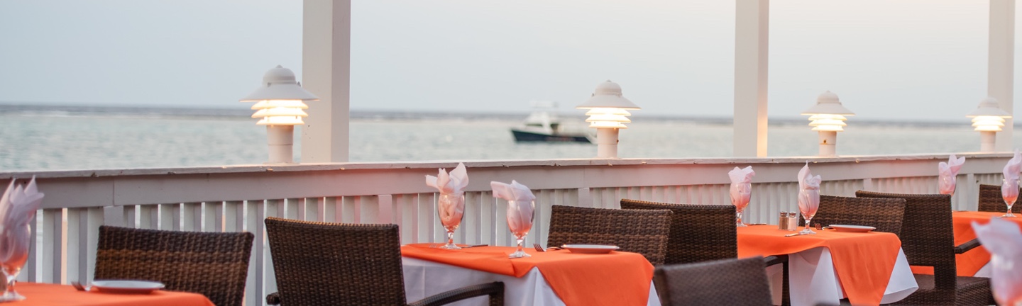David's oceanside patio tables at dusk